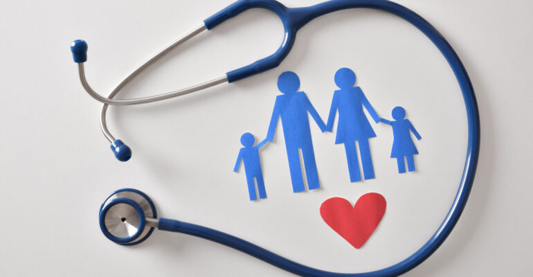 Concept of family medicine with ostetoscope and paper cut